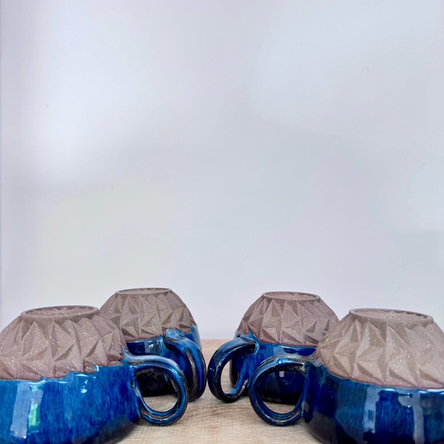 Handmade ceramic cappuccino cups carved blue 1 turned around