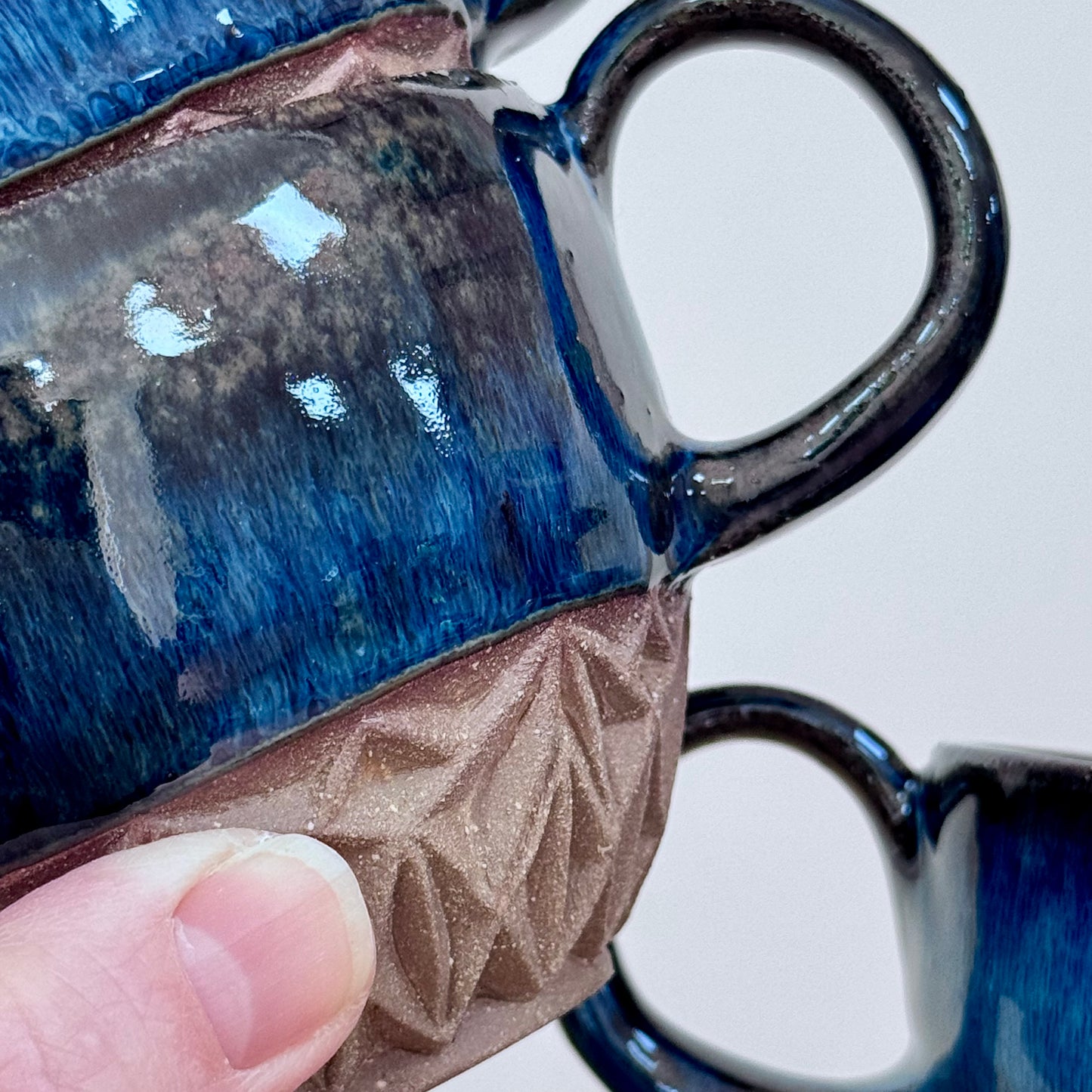 Handmade ceramic cappuccino cups carved blue 2 close