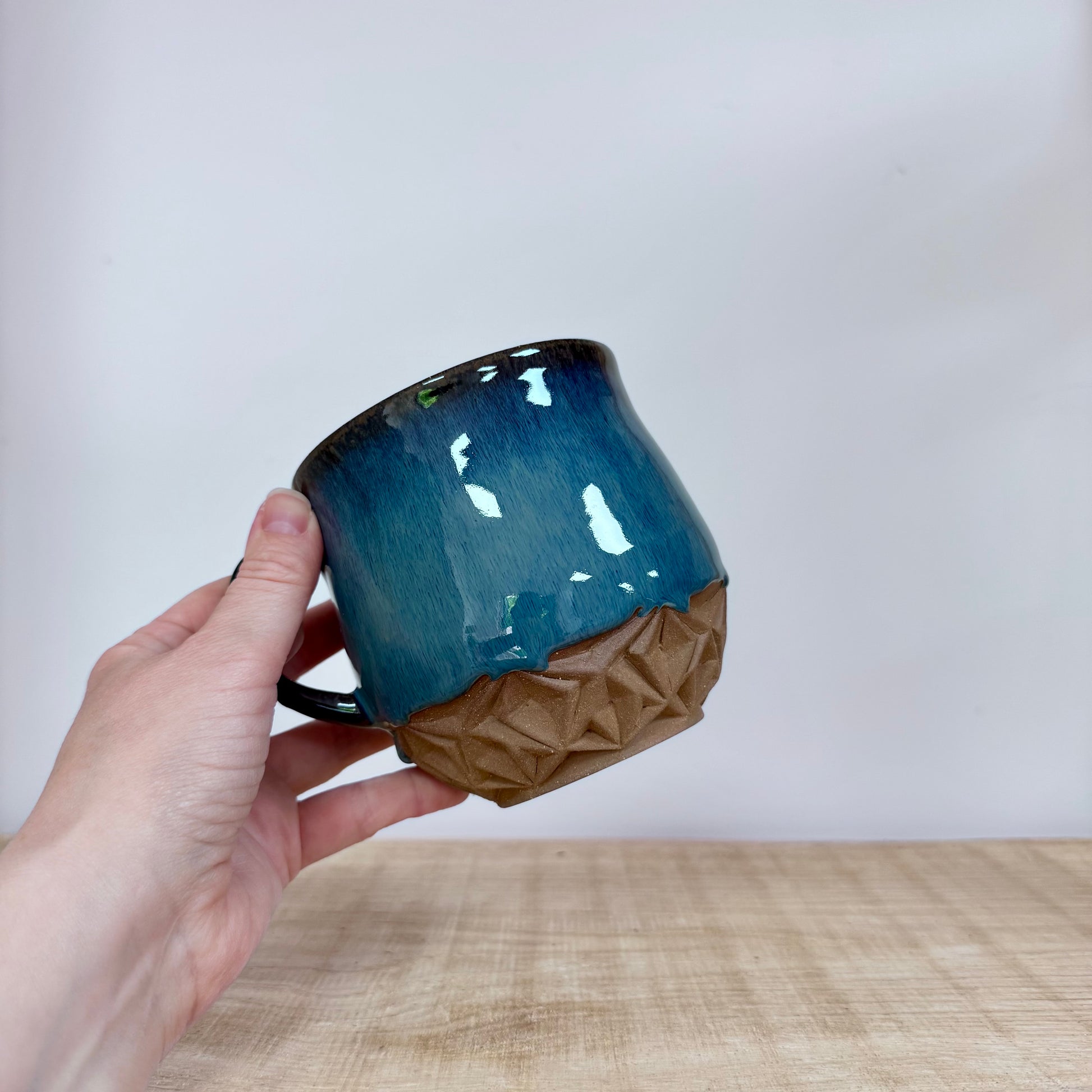 Handmade xxl mugs 650 ml light clay in hand