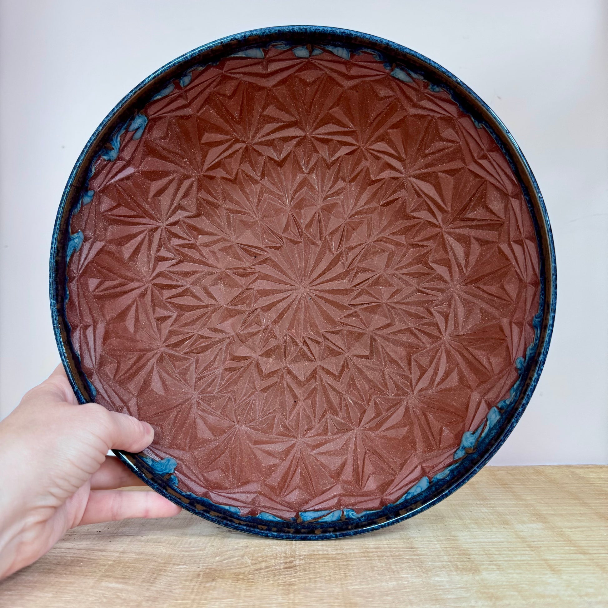 Handmde ceramic bowl carved blue inside pattern